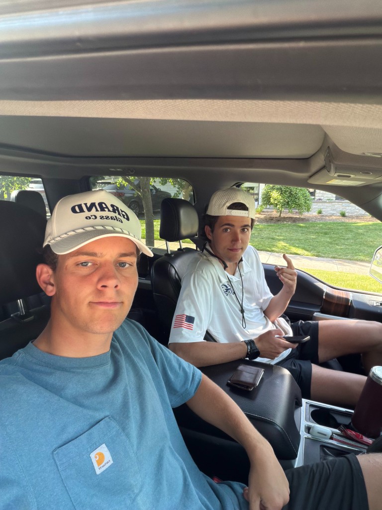 Two Grand Glass Co team members in the work truck